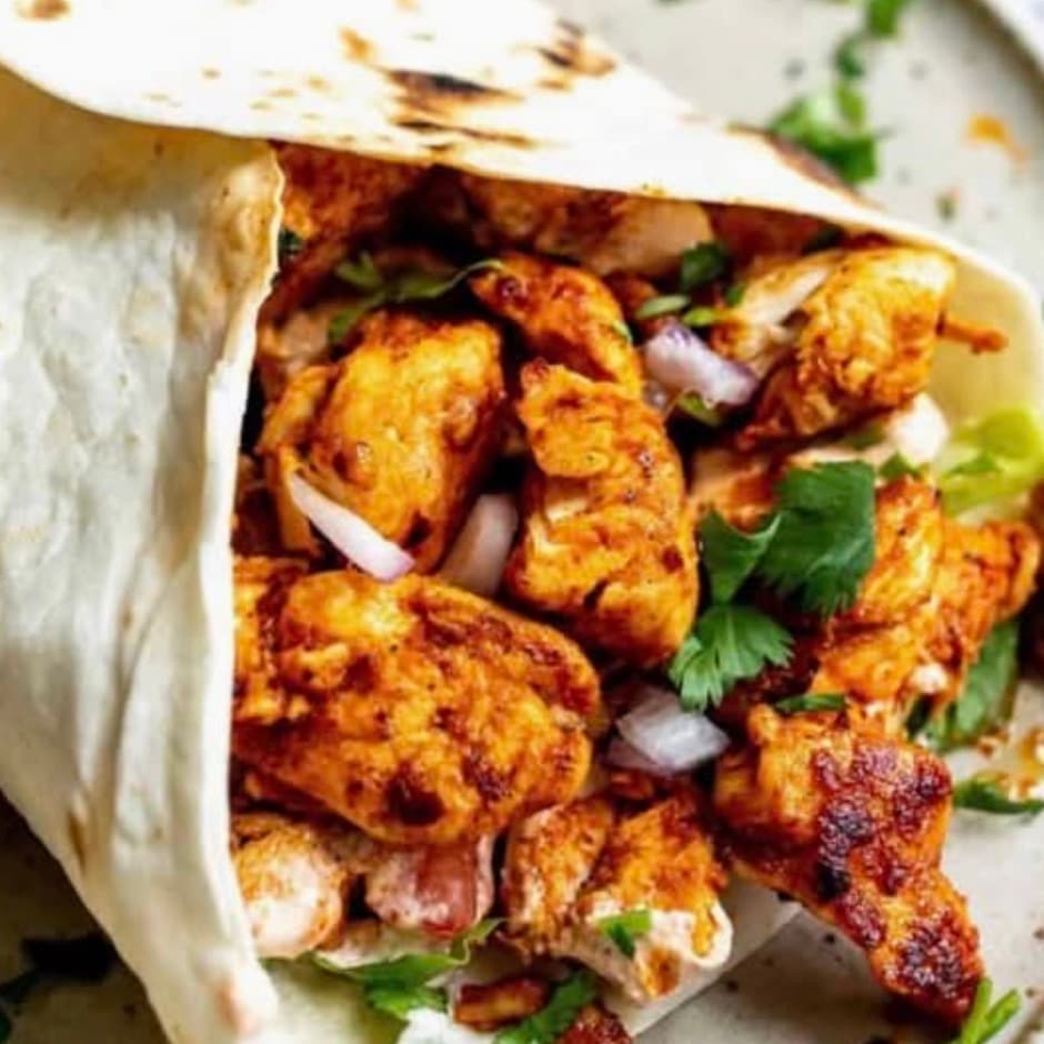 Chicken Spicy Wrap: Marinated chicken grilled with garlic, cumin and chilli, fresh greens